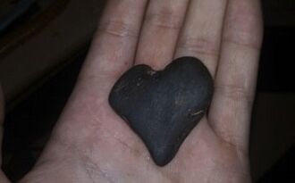 Heart shaped stone as the talisman of good luck