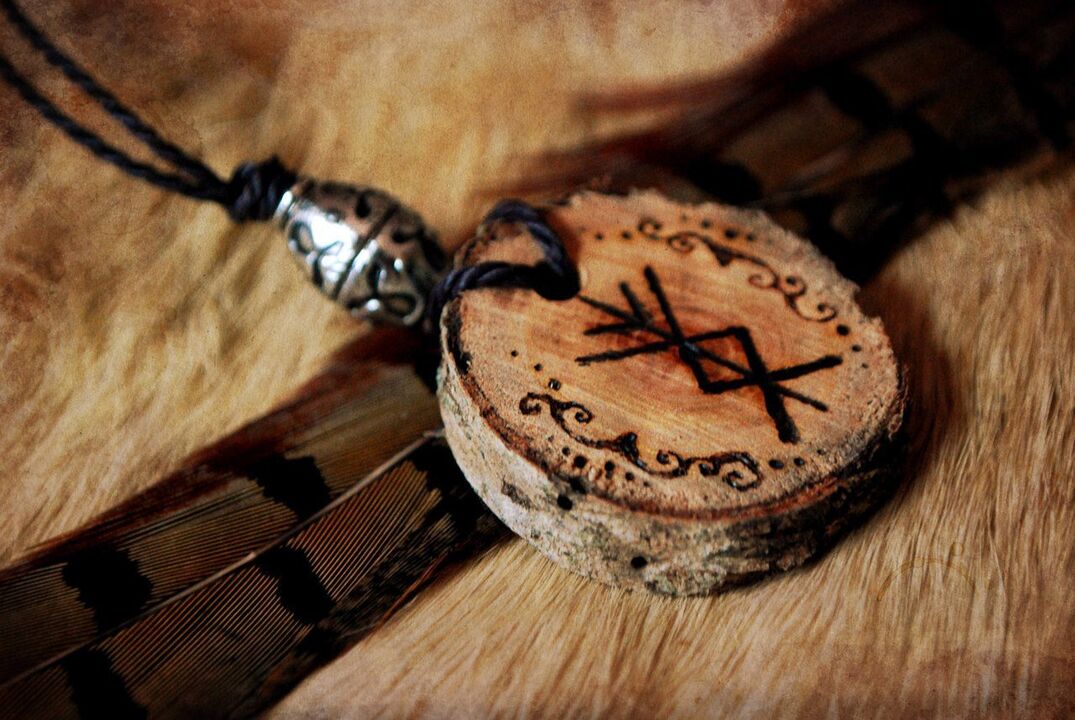 good luck photo 2. Amulet with a rune for